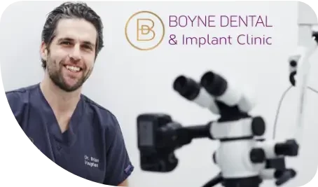 Boyne Dental & Implant Clinic logo with Dentist in background