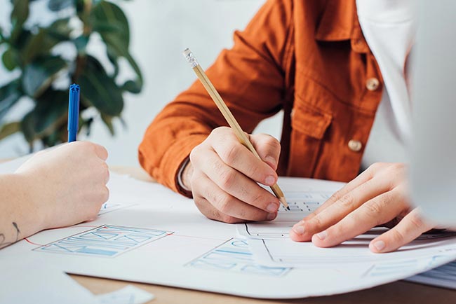 person designing website wireframe